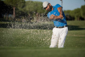 Well-Dressed Golfer Hitting Out of Sand - Proper Golf Attire For Men