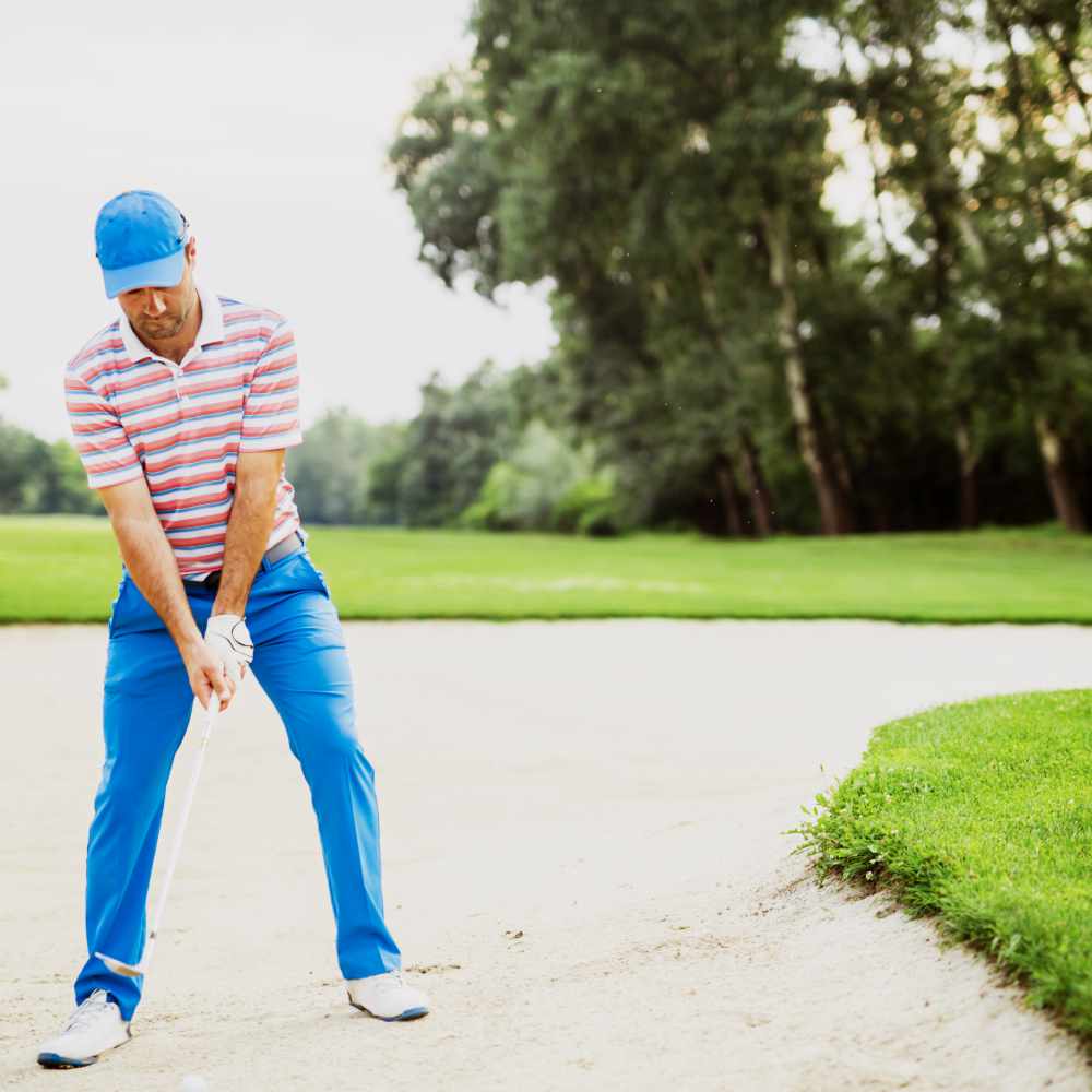 Golfer Takes A Bunker Shot